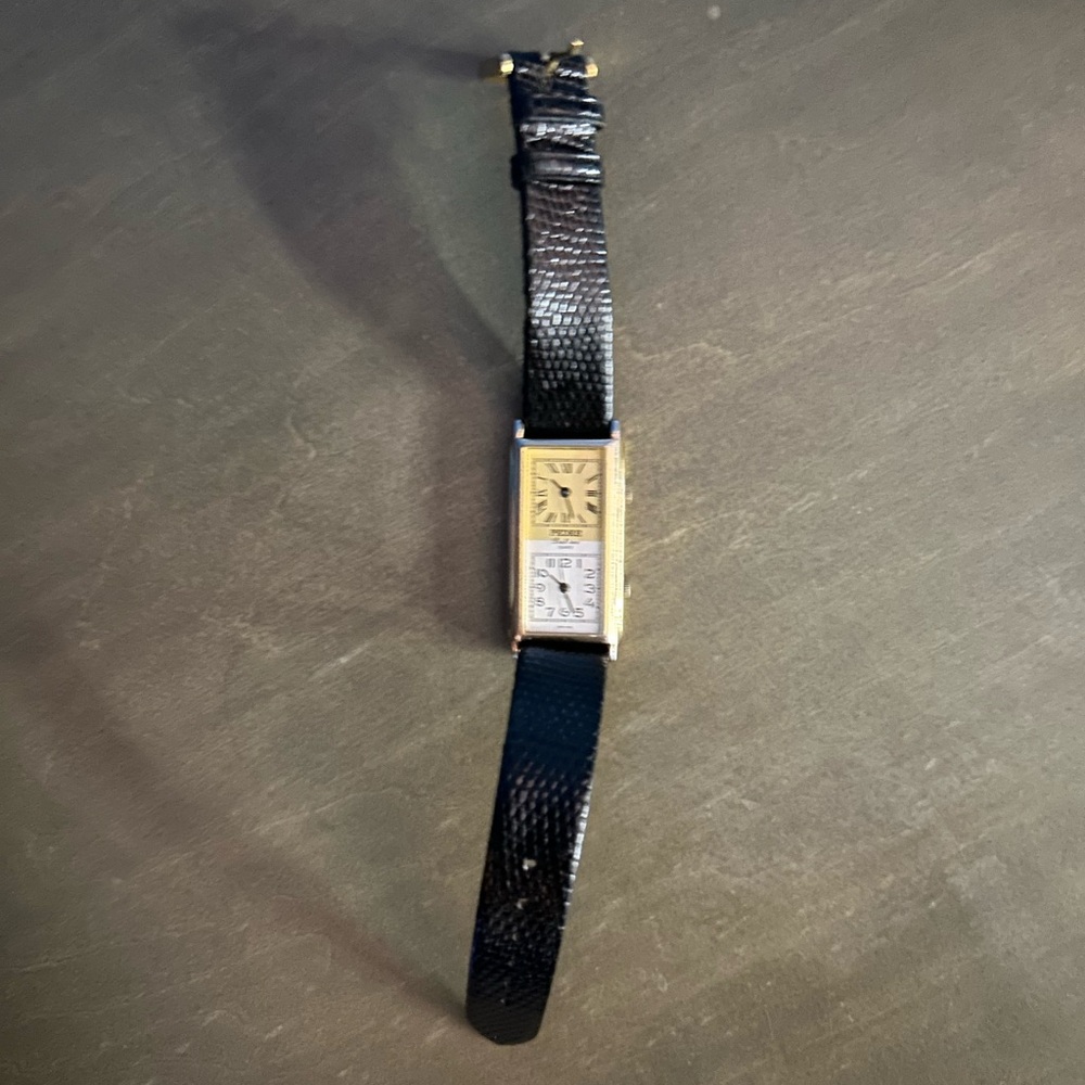 Sleek Black Strap Watch with Gold Face